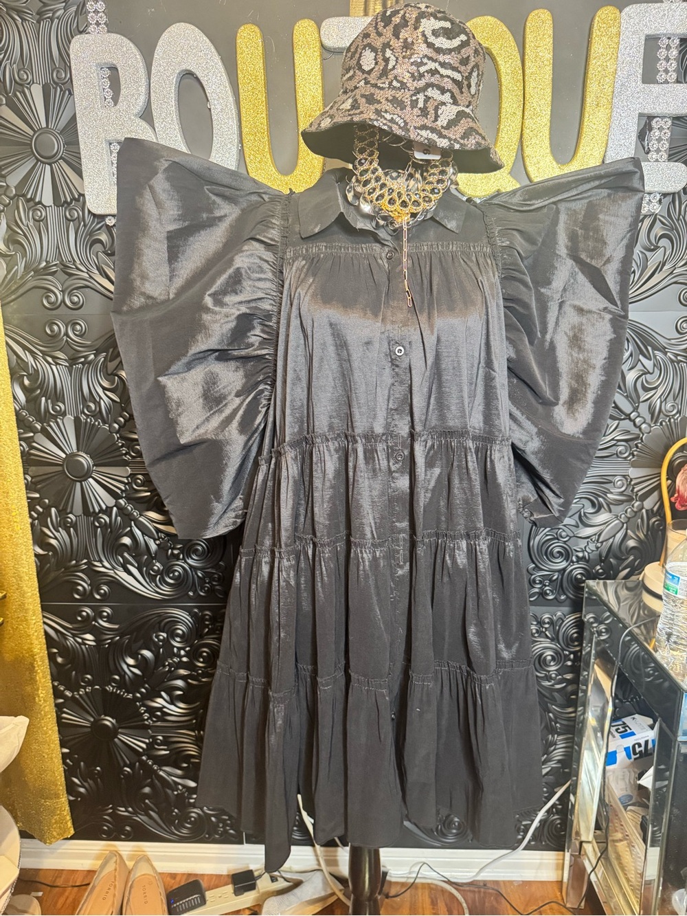 Dramatic Black Tiered Dress with Statement Wings